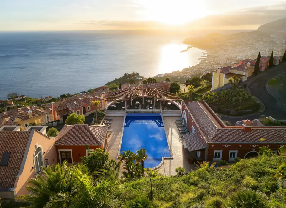 The Palheiro Village pool above Funchal at sunset